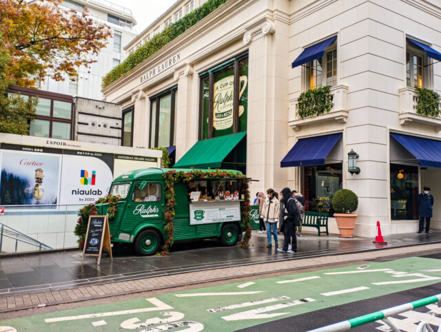 Ralph’s Coffee exterior with a truck parked outside the Ralph Lauren store in Harajuku, Tokyo, decorated with festive greenery.