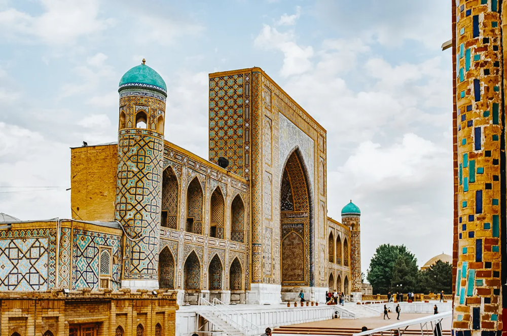Tilya-Kori Madrasa at Registan Square in Samarkand with turquoise dome and ornate facade
